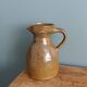 Rustic stoneware jug, chic countryside.