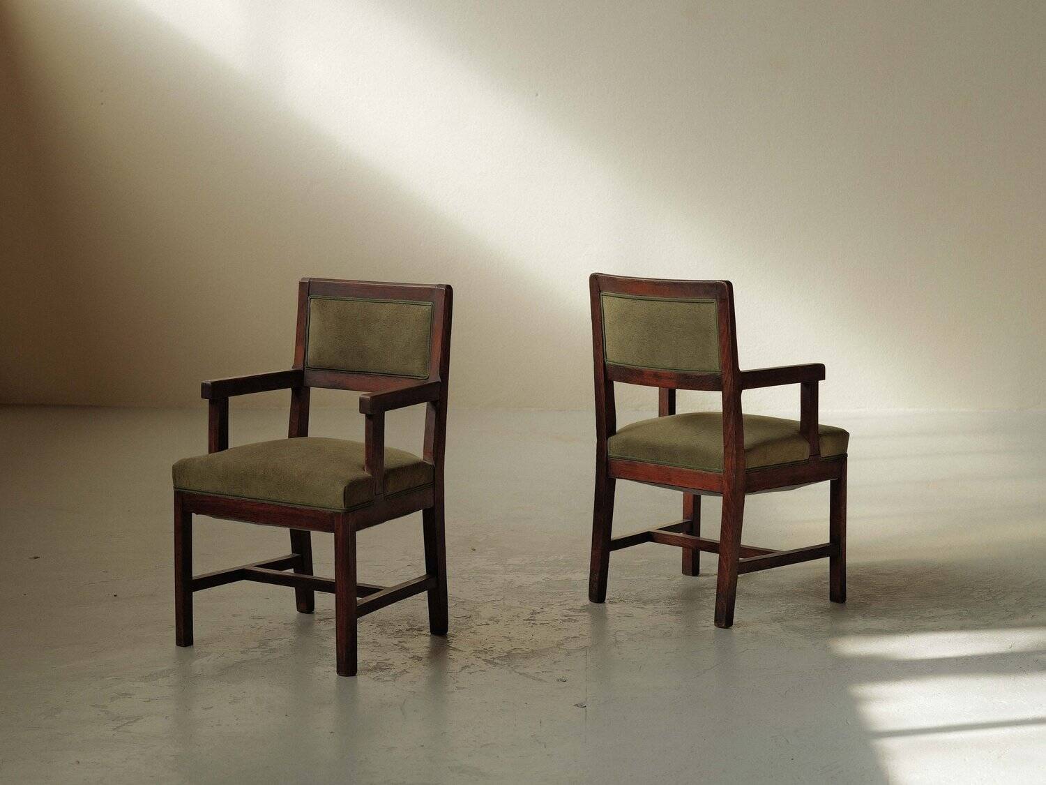 Pair of modernist armchairs in solid oak, France, circa 1940.