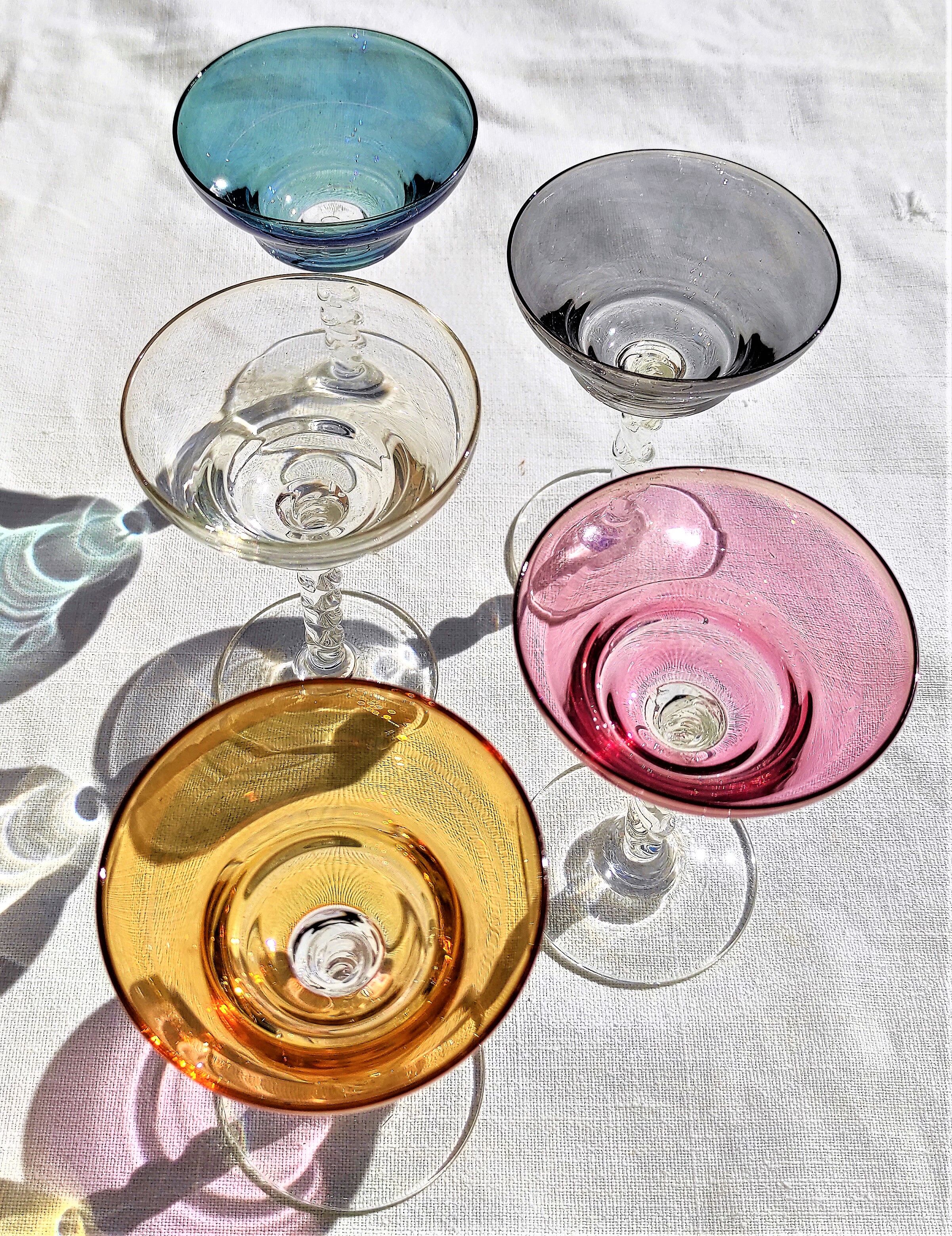 Twisted foot glasses of different color