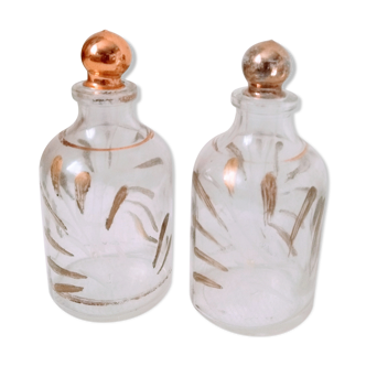 2 bottles / small old style glass bottles the patterns of golden leaves have been repainted