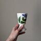 Ceramic mazagran with hand-painted floral decoration.