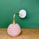 Vintage pink Clichy glass globe wall light.
