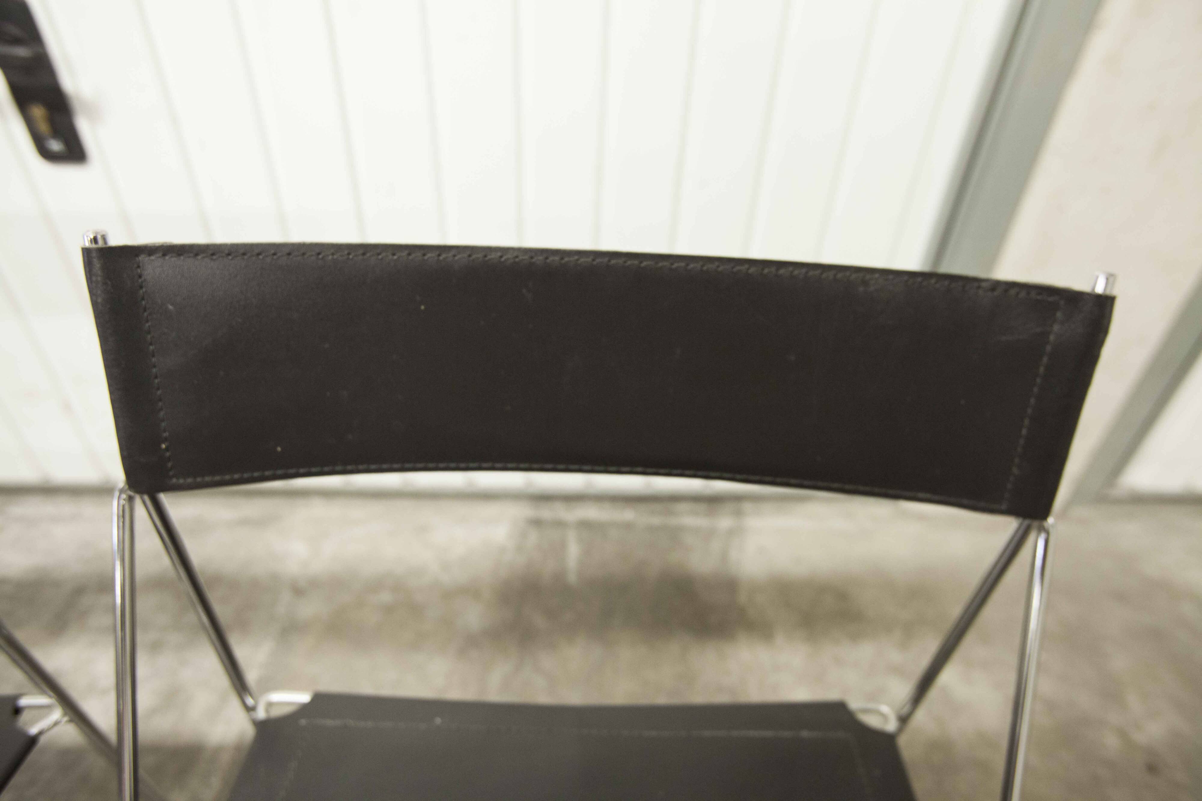 Set of 3 minimalist X line chairs by Niels Jorgen Haugesen.