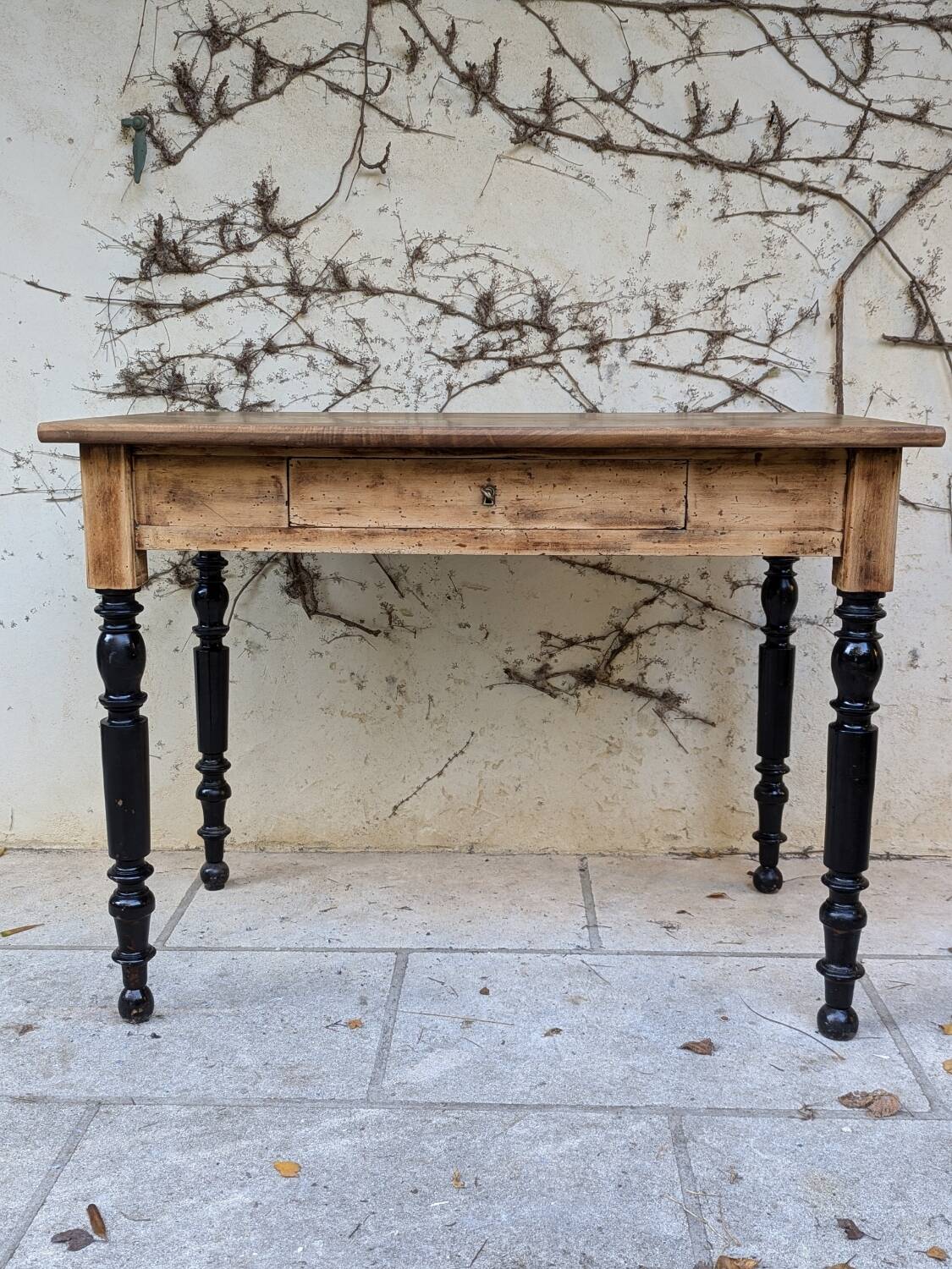 Solid wood desk, black base