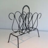 Magazine rack in leather and black lacquered metal. Attributed to Jacques Adnet