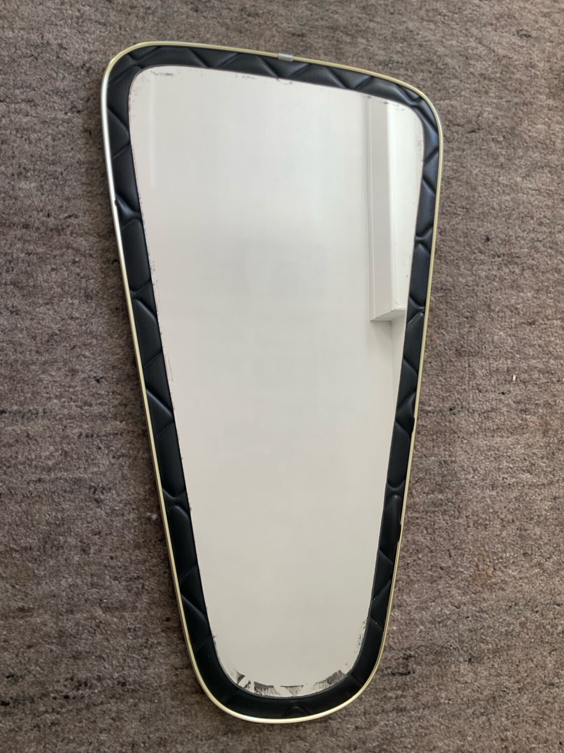 Asymmetrical mirror from the 1960s.