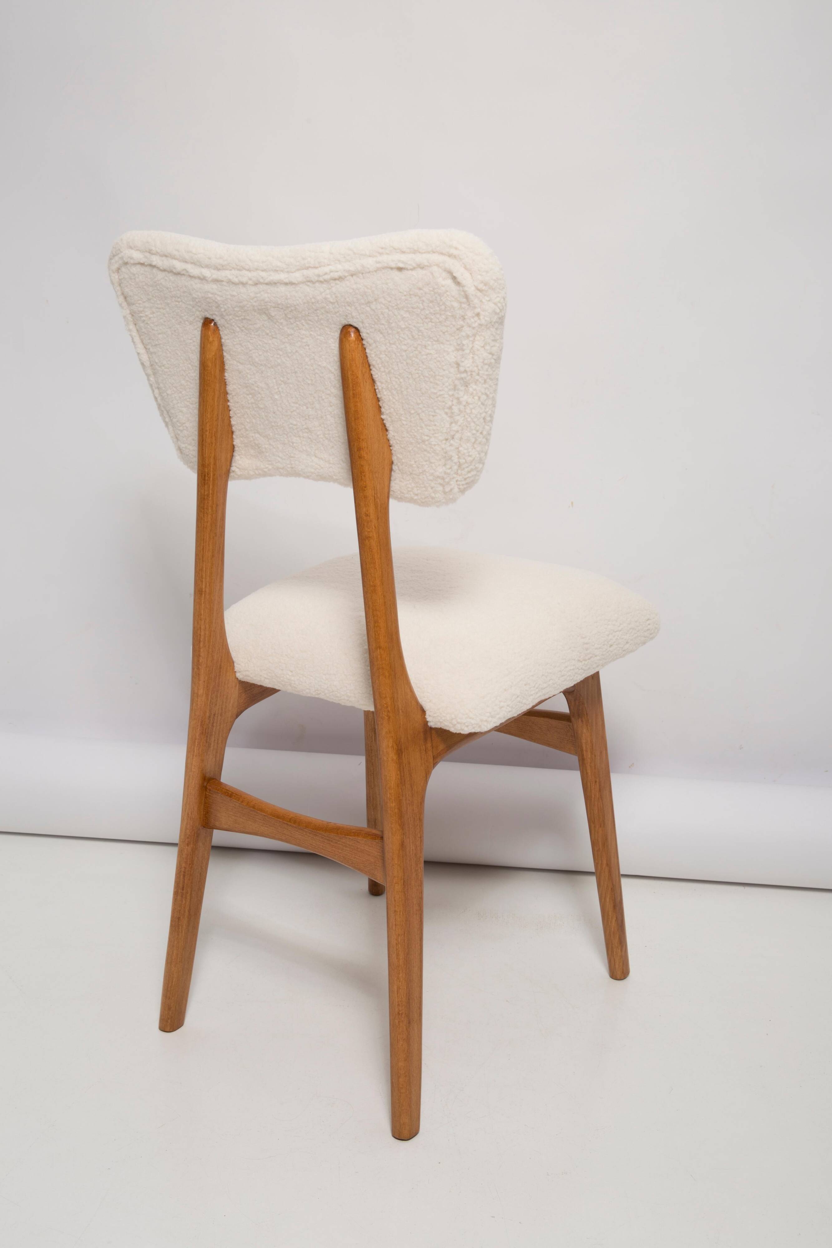 Butterfly chair in beech wood and cream boucle, Europe, 1960