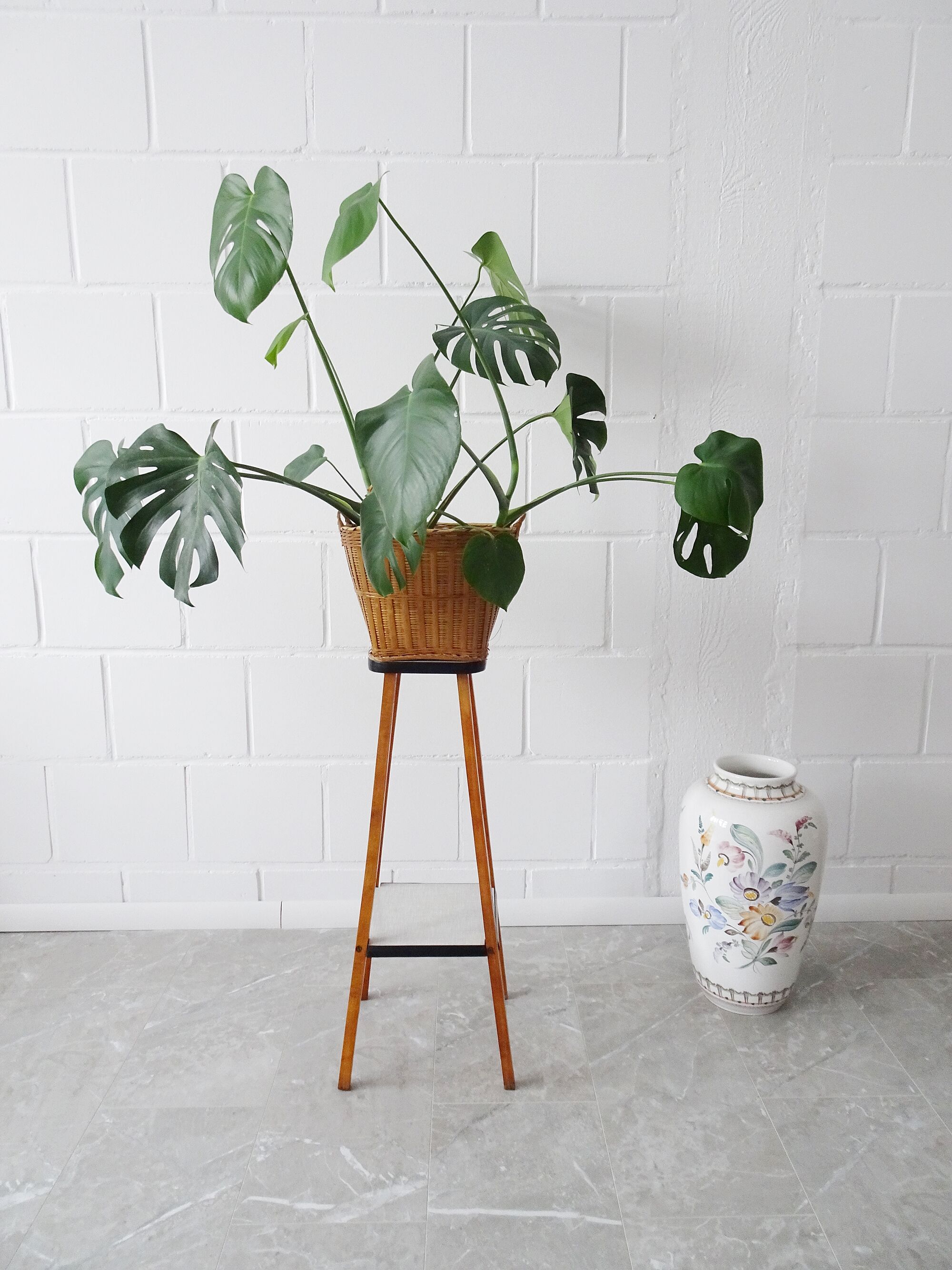 Plant stand made of wood and formica with two shelves, flower column