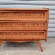 Commode vintage pied compas et rotin