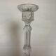 Thick moulded glass candlestick with fish and flowers.