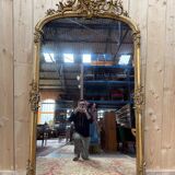 Napoleon III mirror in wood and gilded stucco with gold leaf.