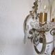 Pair of sconces in patinated metal and crystal tassels