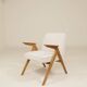 Vintage armchair in rustic oak with pearl bouclé, designed by Chierowski.