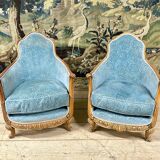Art deco living room around 1920 in carved wood upholstered in blue velvet, a sofa two armchairs
