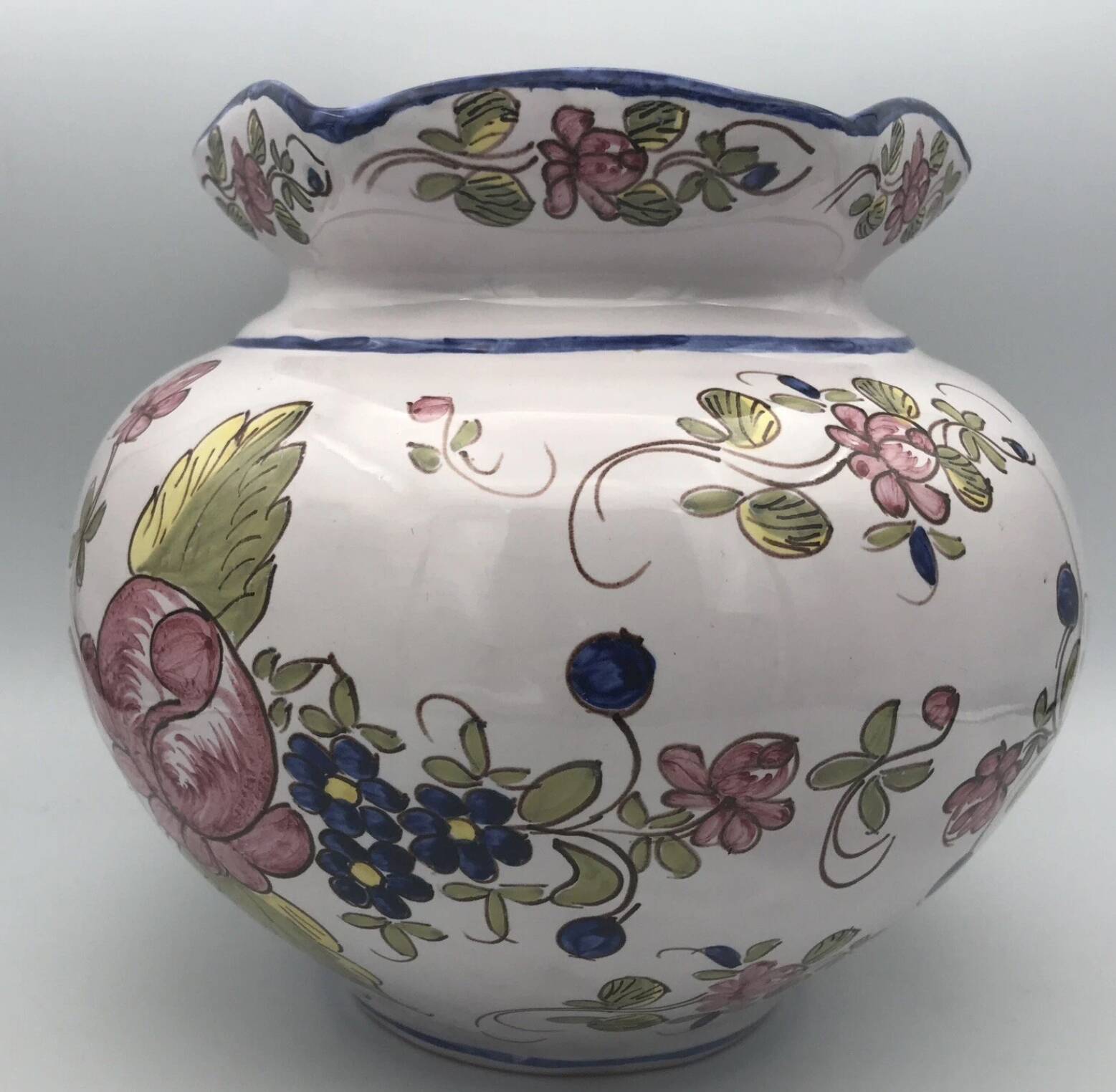 Round earthenware vase with polychrome floral motifs, signed