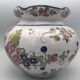Round earthenware vase with polychrome floral motifs, signed