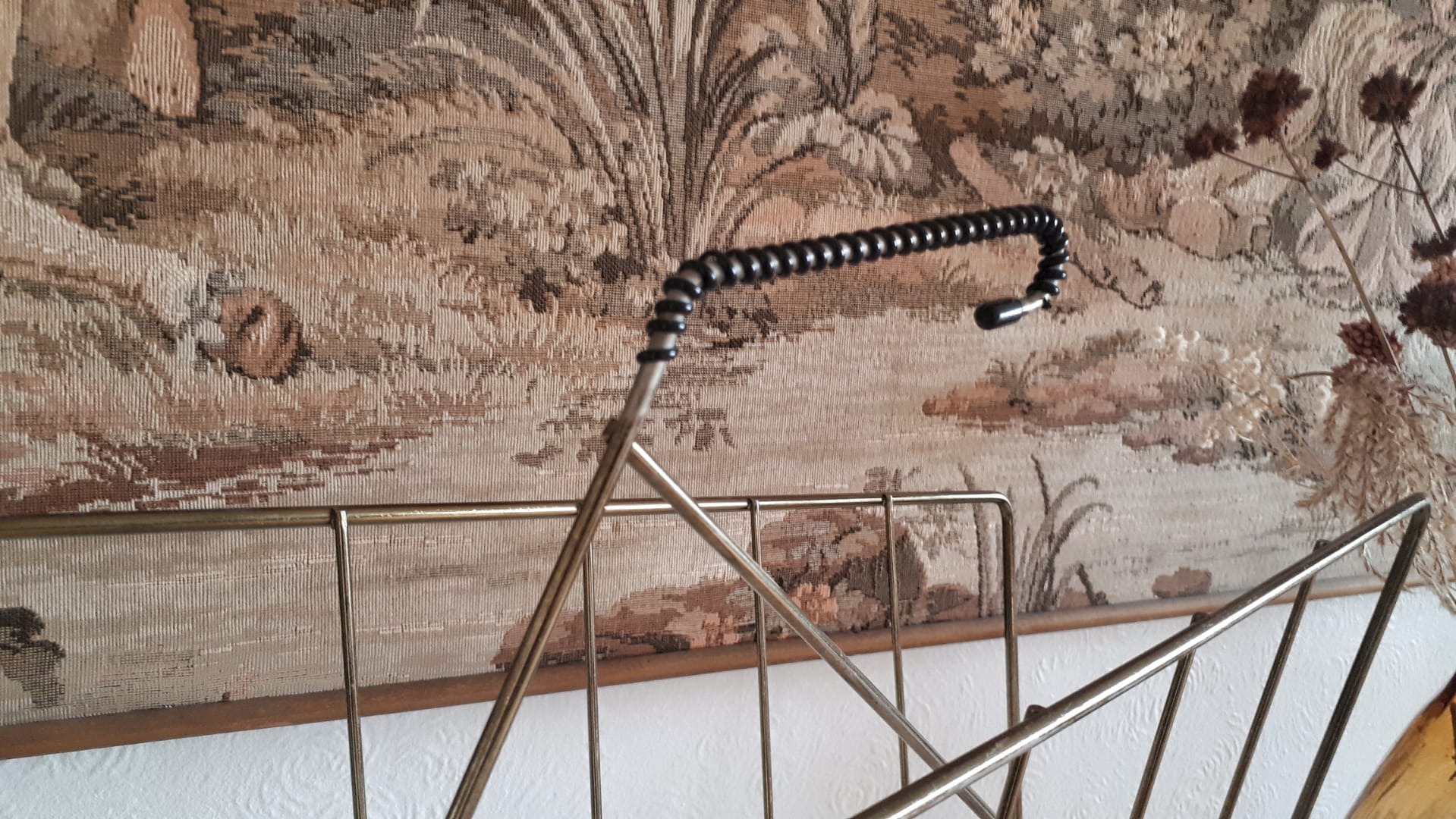 Gold metal newspaper holder