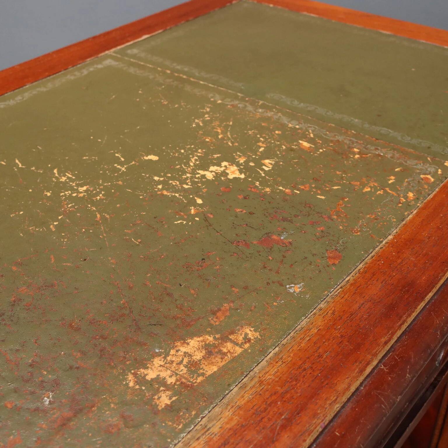 Antique mahogany desk with leather and bronze writing pad, 20th century.