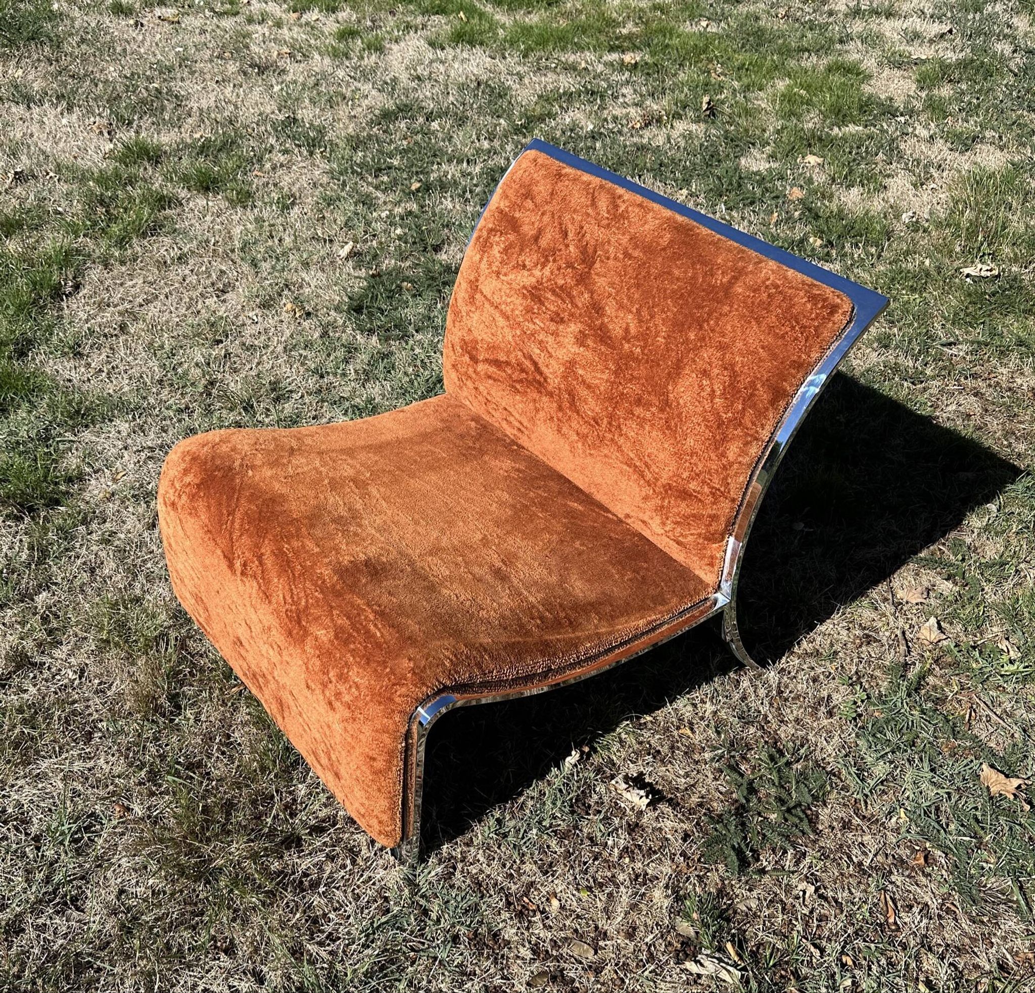 Chrome steel armchair and orange fabric by Vittorio Introini
