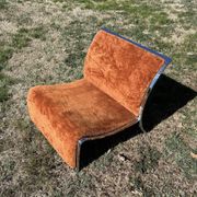 Chrome steel armchair and orange fabric by Vittorio Introini