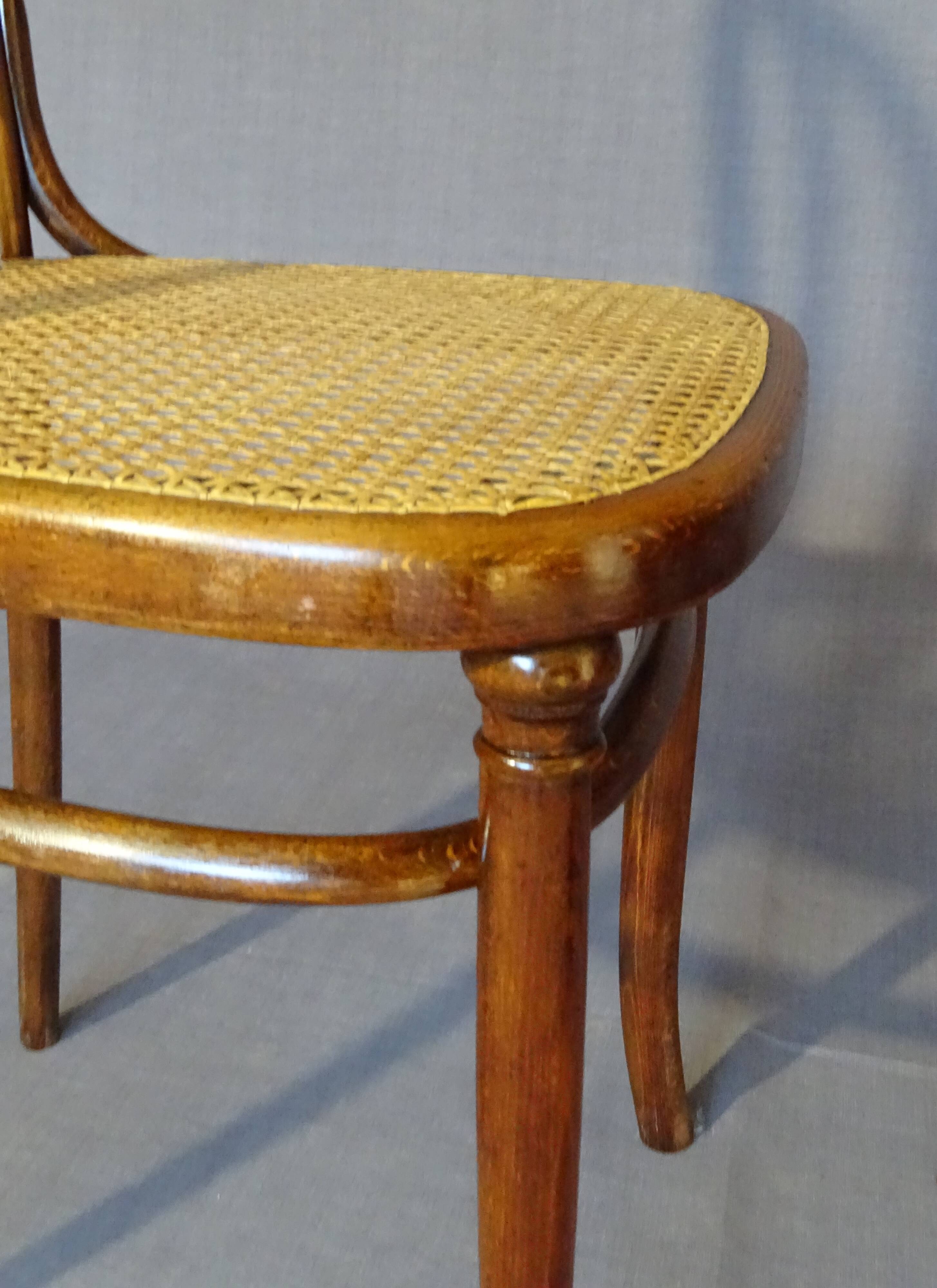 Fake pair of Kohn and Turpe tanned bistro chairs, circa 1900,
