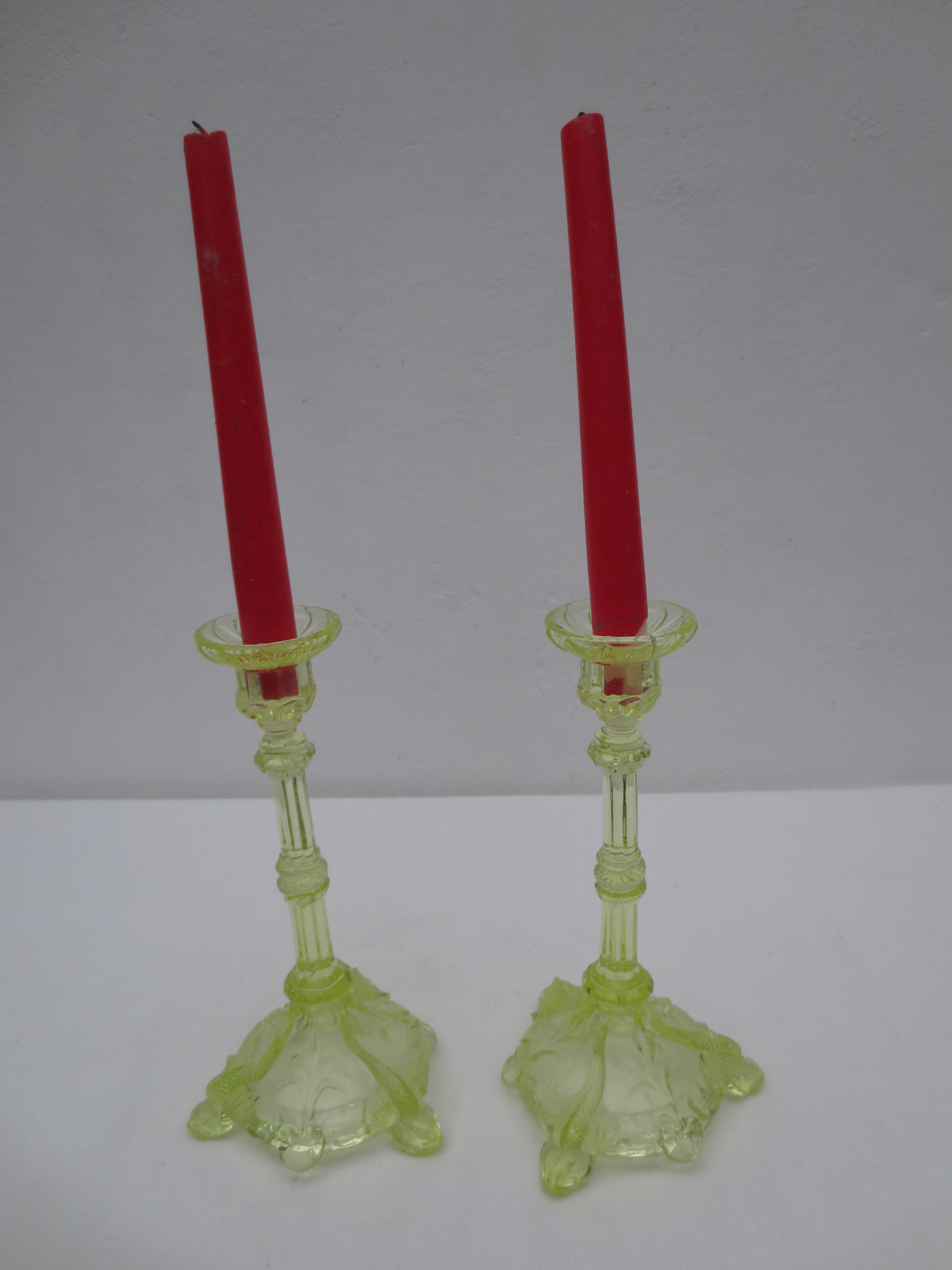 pair of old anise-green glass candlesticks