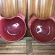 Pair of red ceramic hen dish