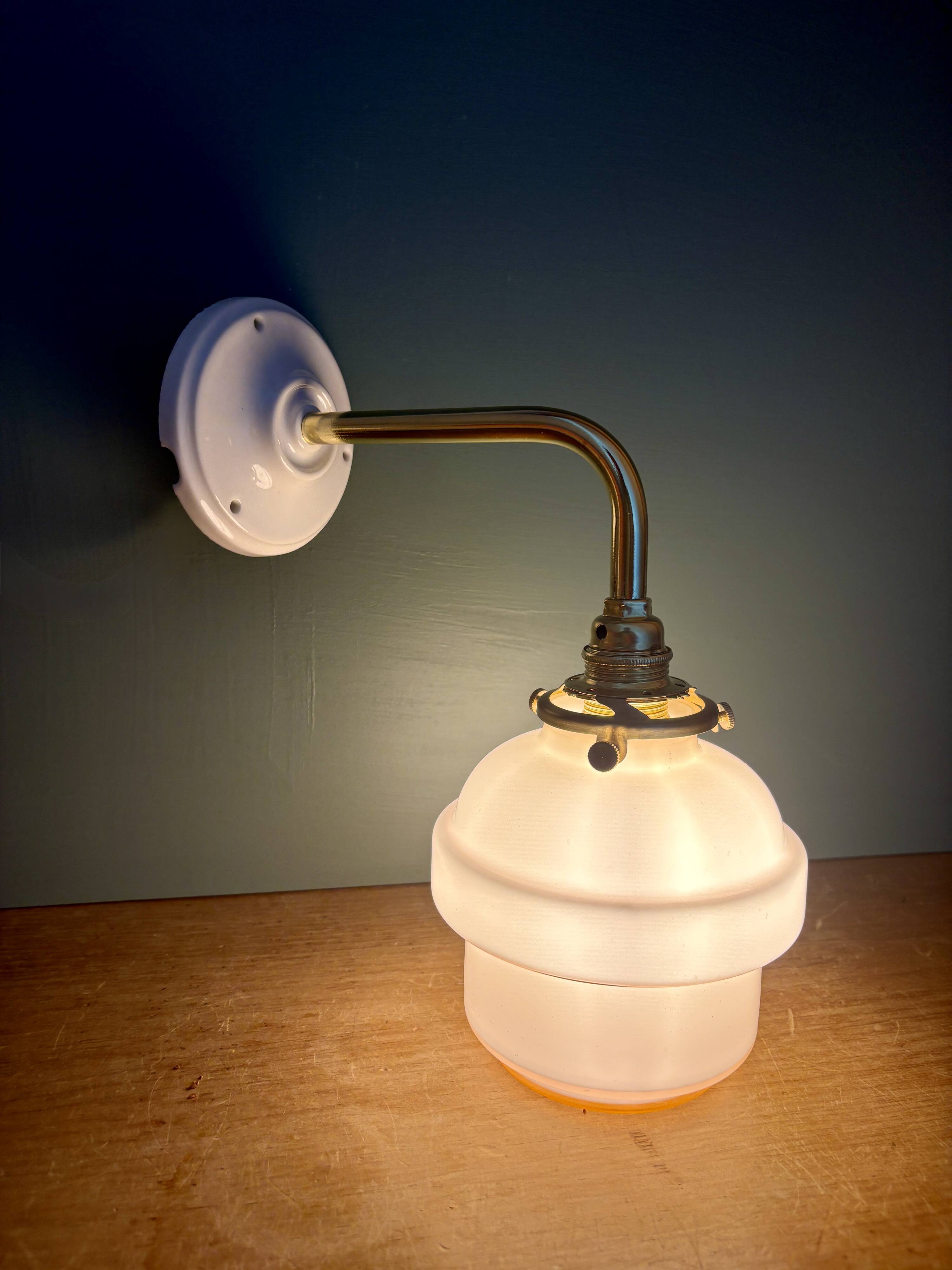 Vintage pink opaline globe wall light.