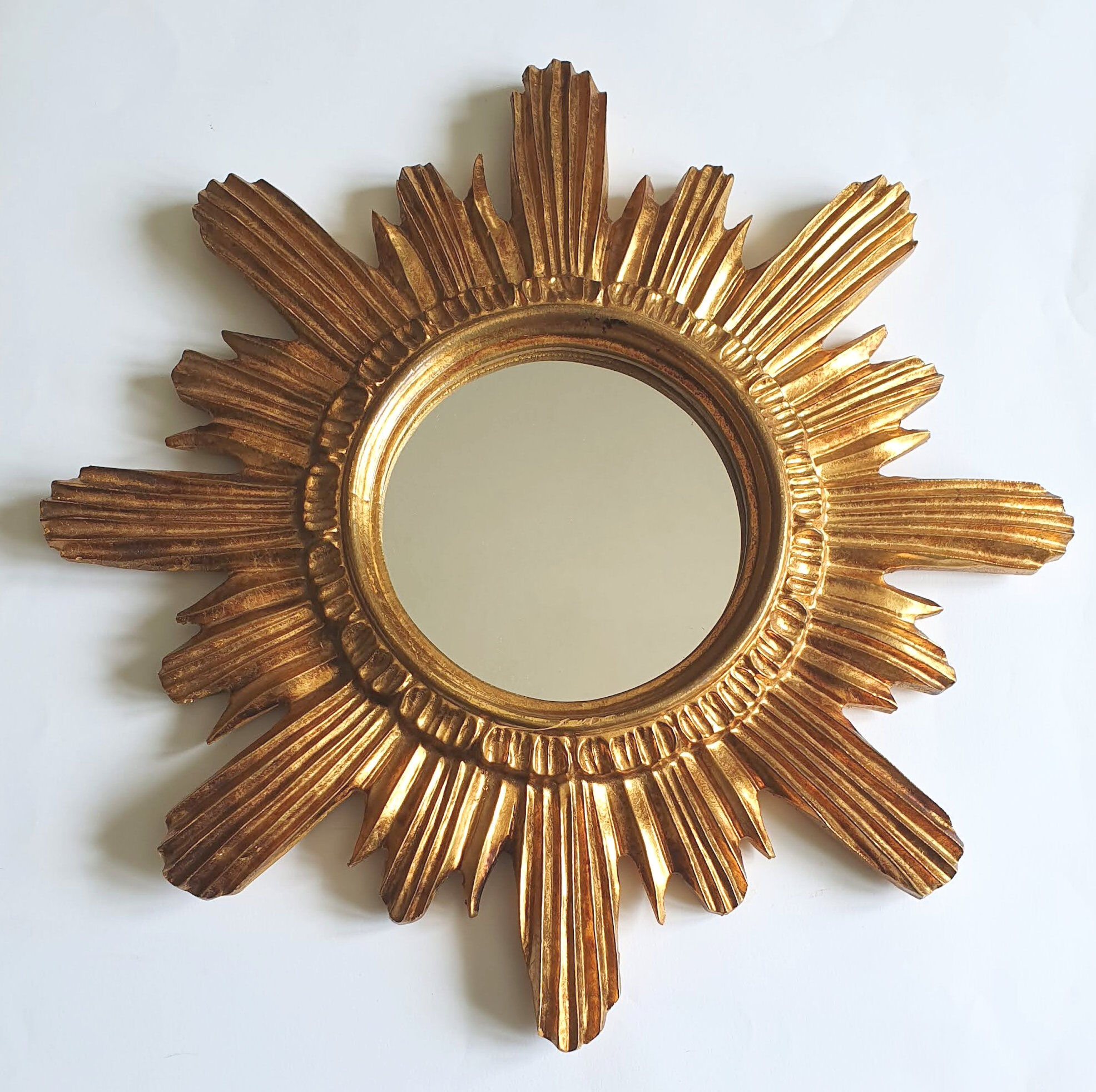 Sun mirror in gilded wood