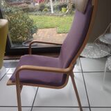 Relaxing armchair and its Scandinavian footrest