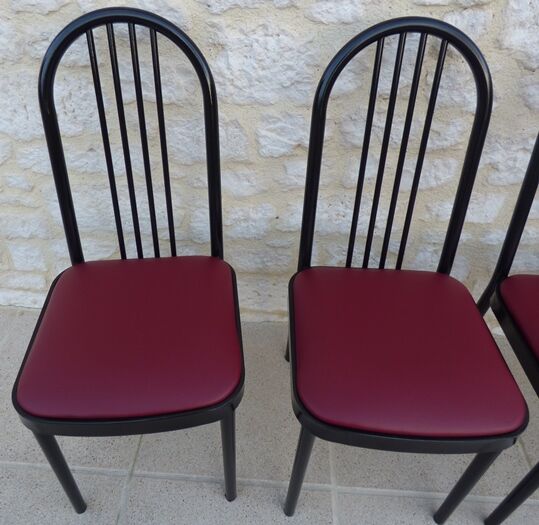 4 metal chairs with burgundy imitation leather seats from the Souvignet brand