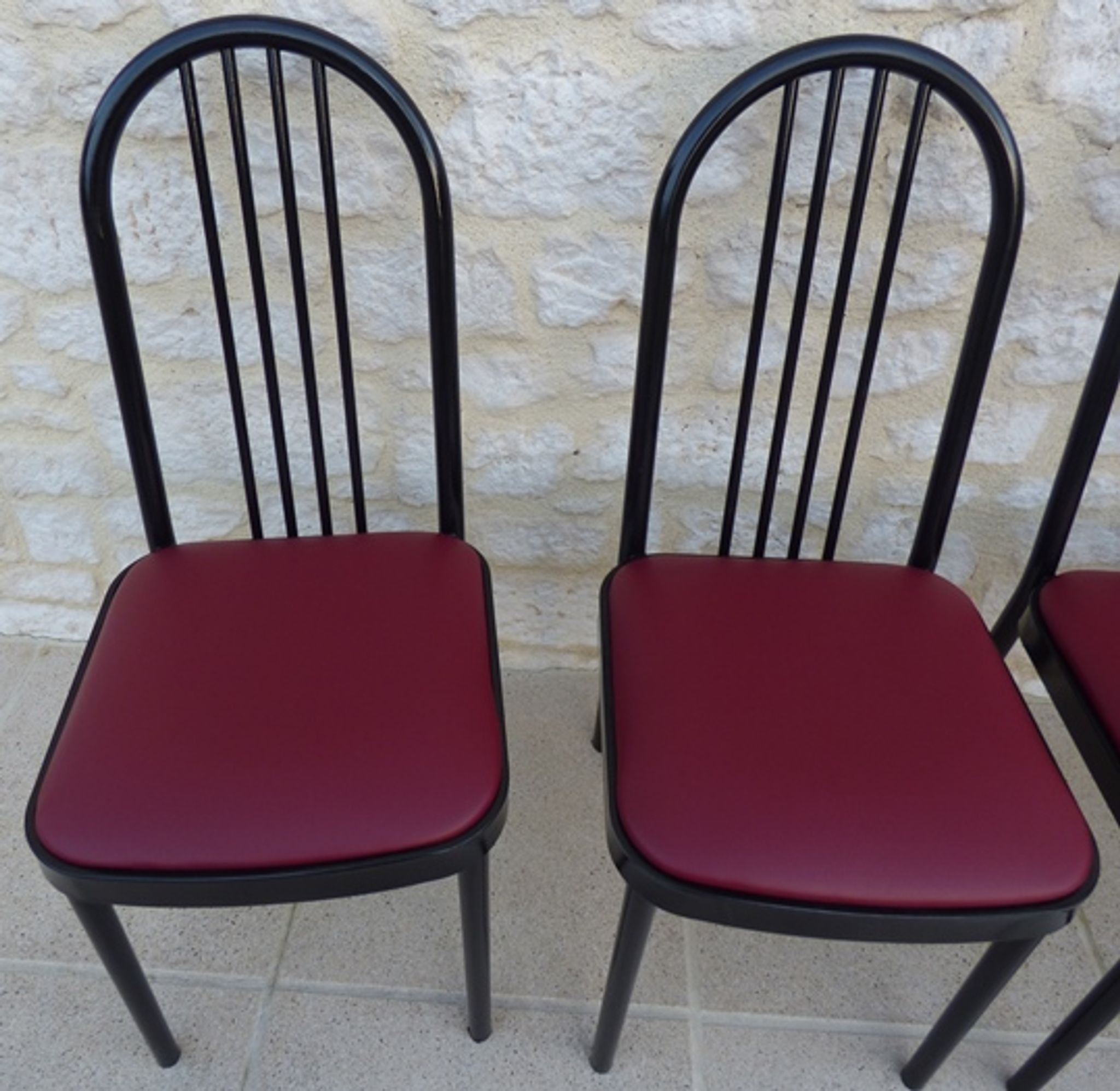 4 metal chairs with burgundy imitation leather seats from the Souvignet brand