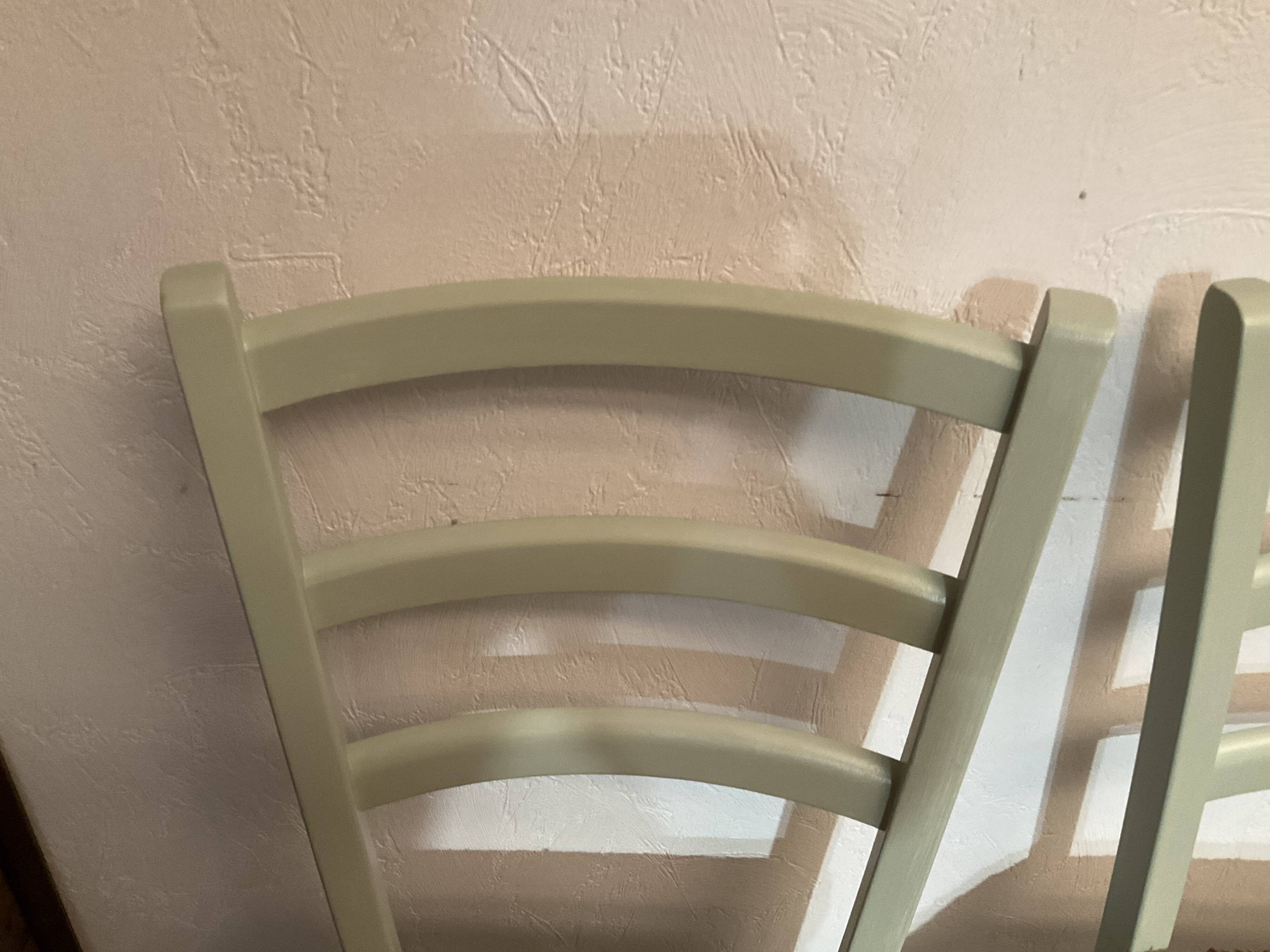 Pair of green straw chairs