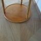 Round coffee table in bamboo, rattan, and wood with an 80s star pattern.