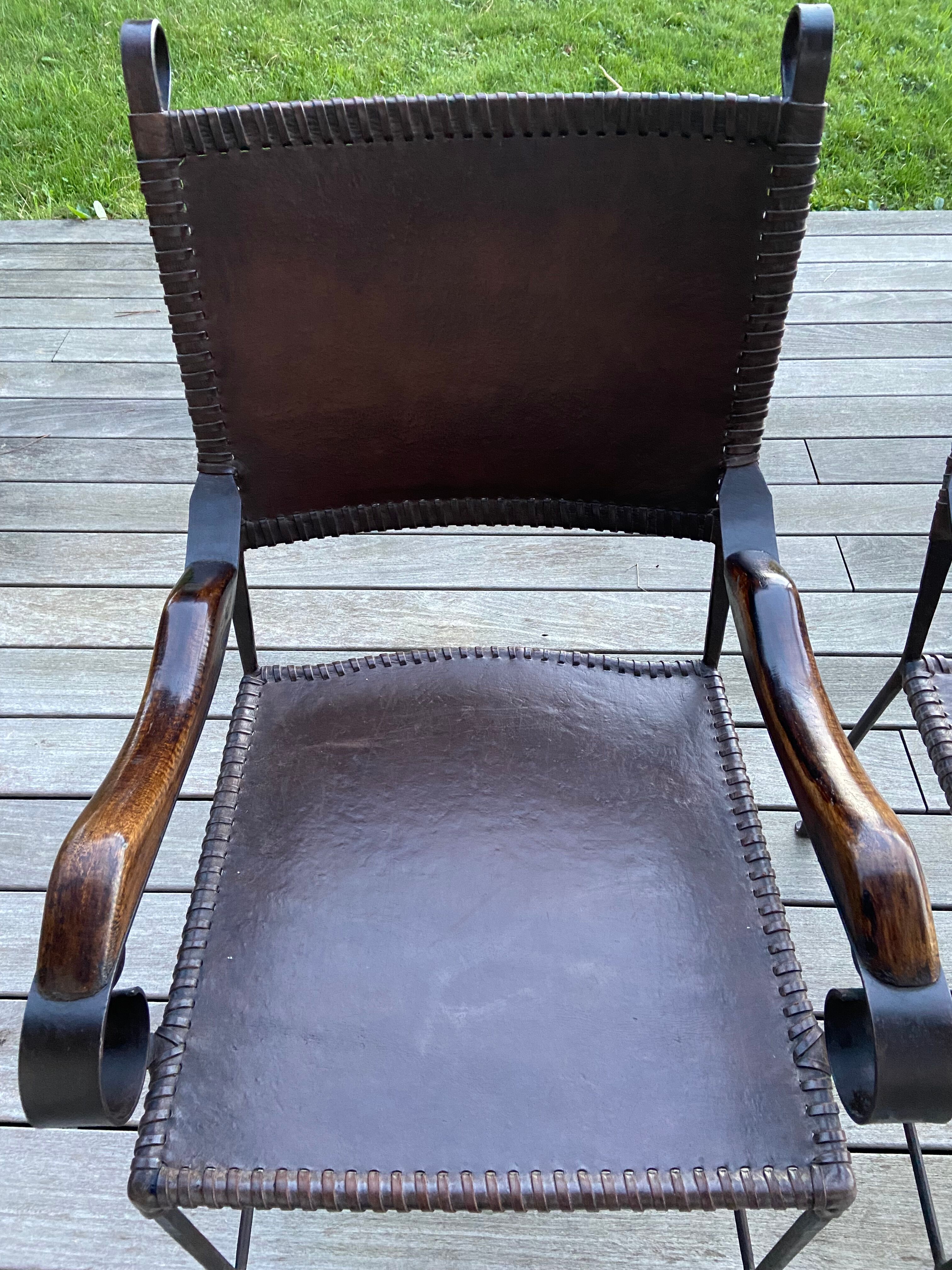 Leather and wrought iron armchairs