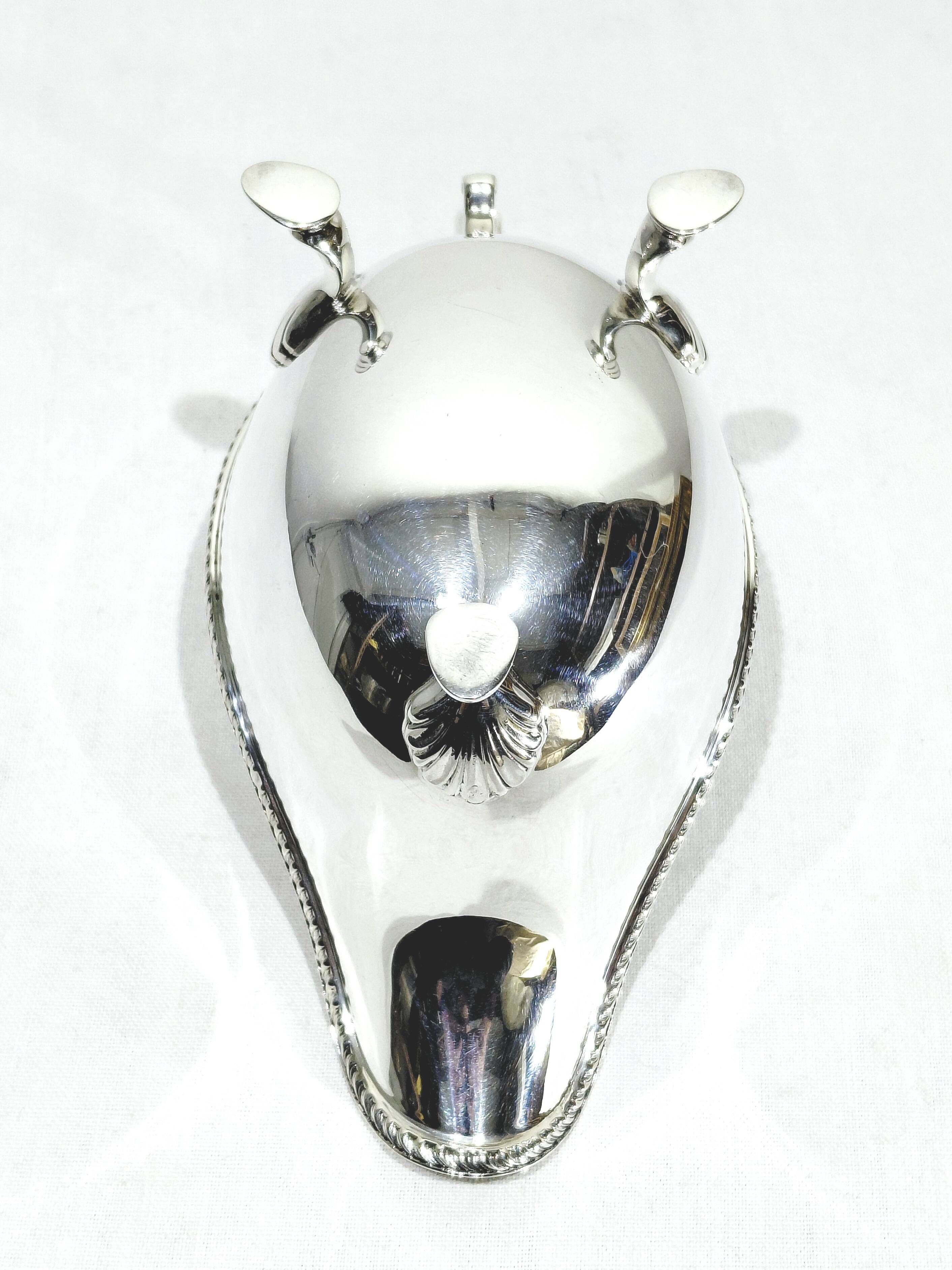 Silver sauceboat, England