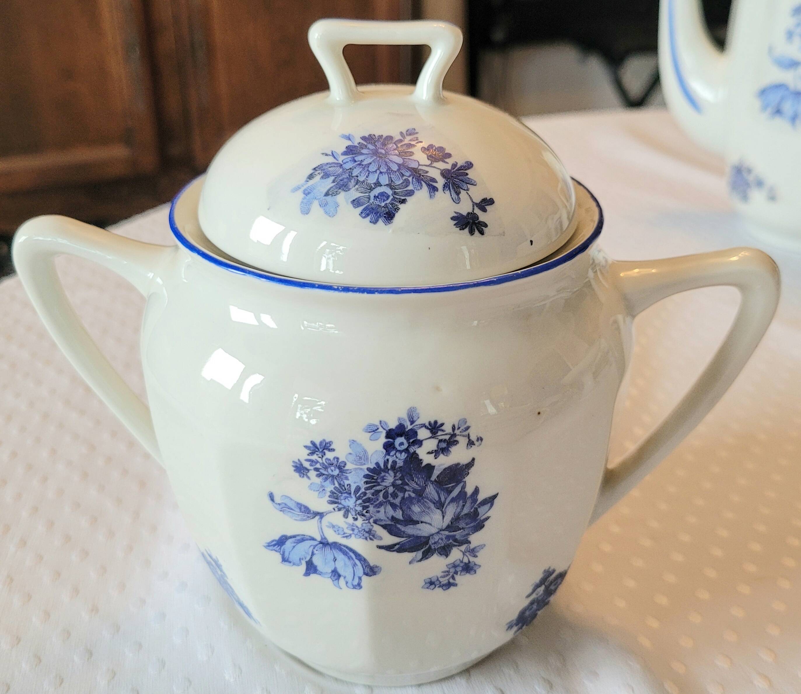 Blue and white ceramic coffee service with flowers.