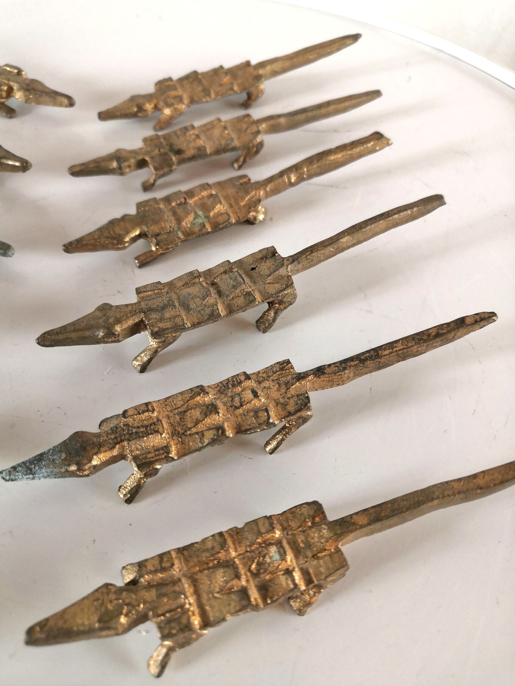 12 vintage bronze knife rests