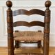 Low fireplace chair in the style of Charles Dudouyt