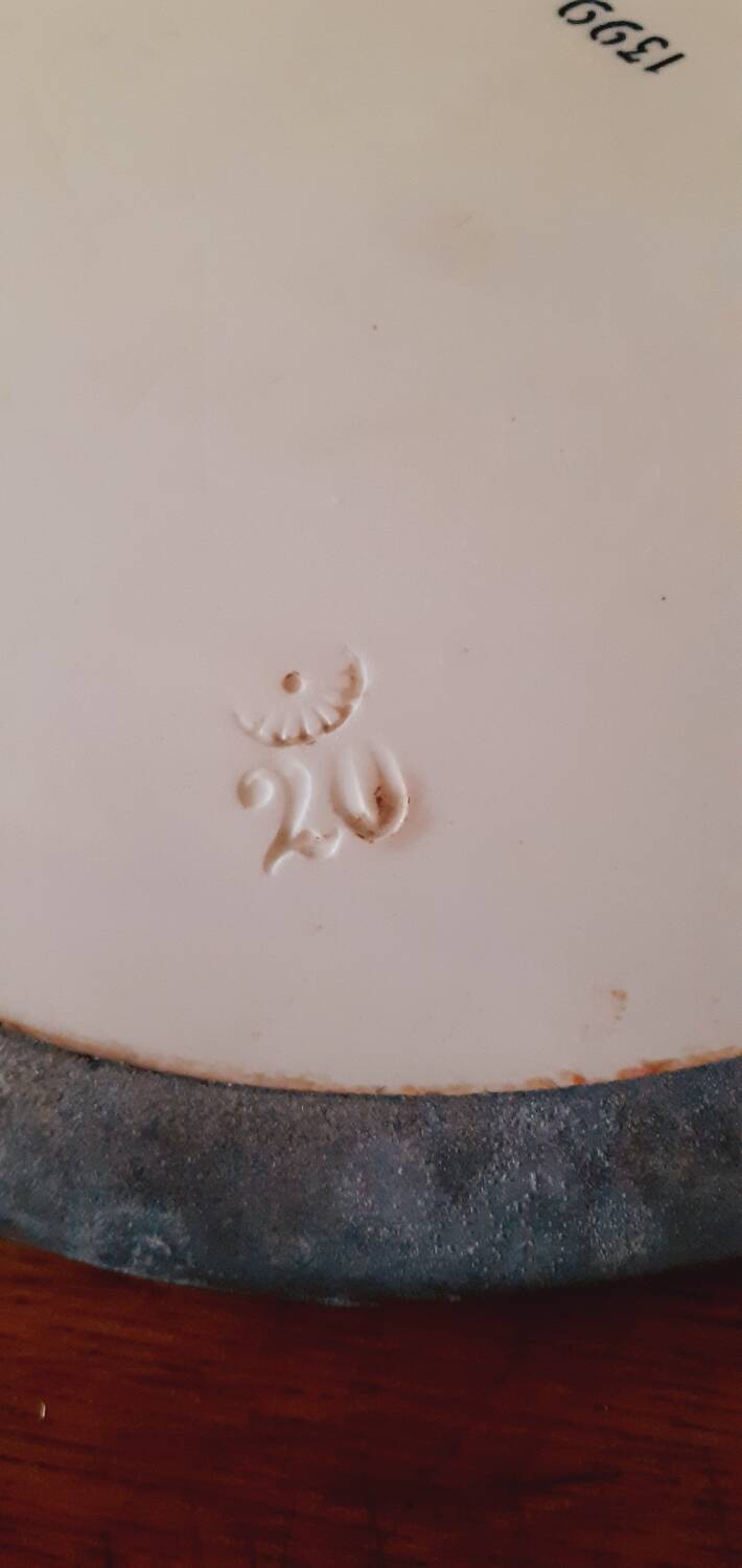 Porcelain and zinc trivet circa 1900