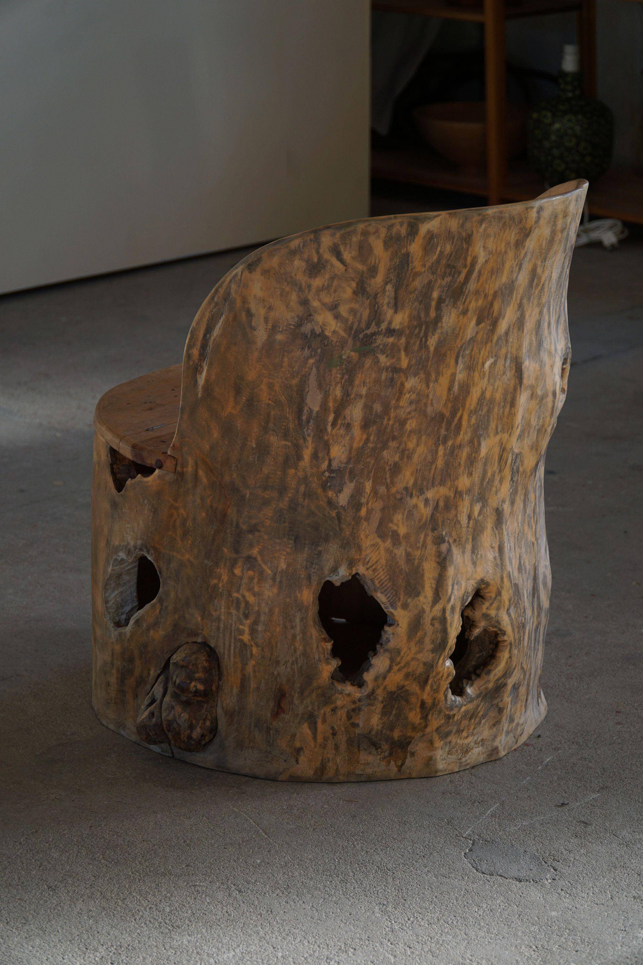 Sculptural Norwegian trunk chair in mid-century brutalist solid wood.