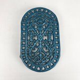 Dessous de plat ajouré en fonte bleu émaillé