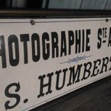 Photographer enamel sign