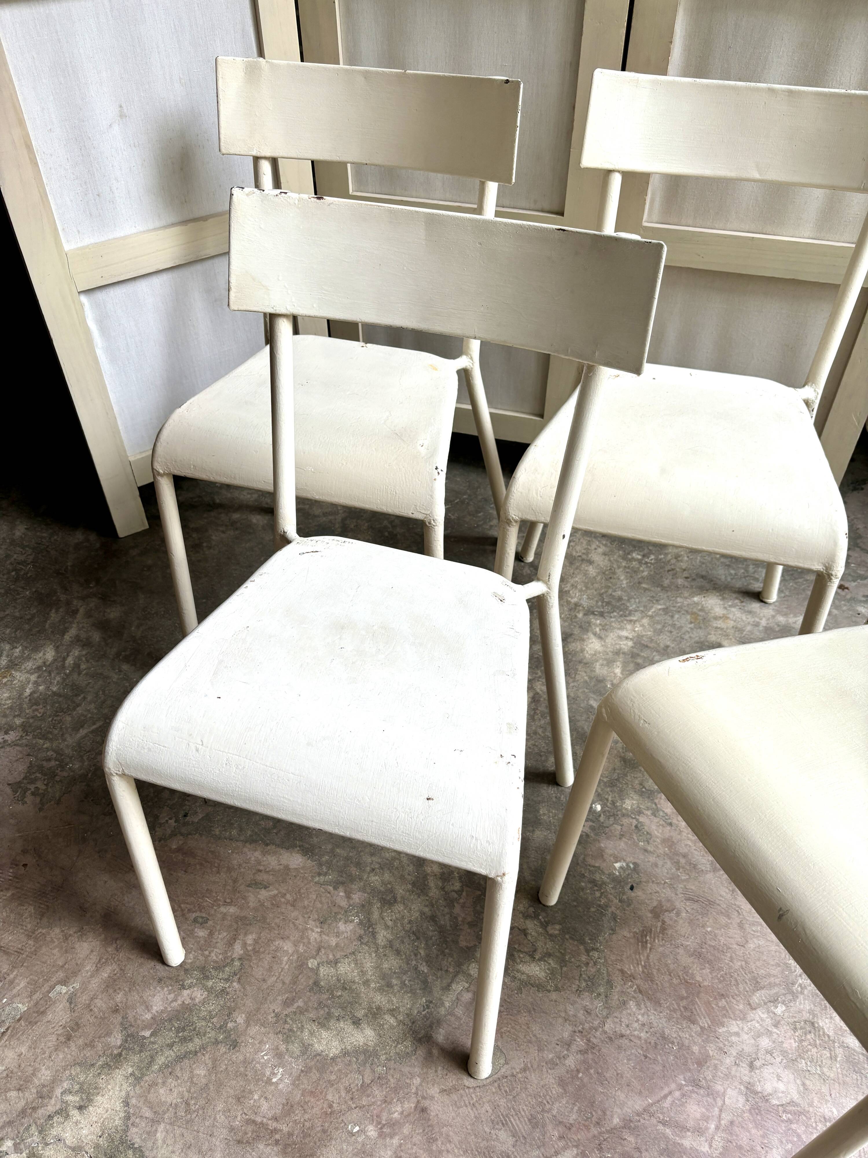 4 beige metal garden chairs
