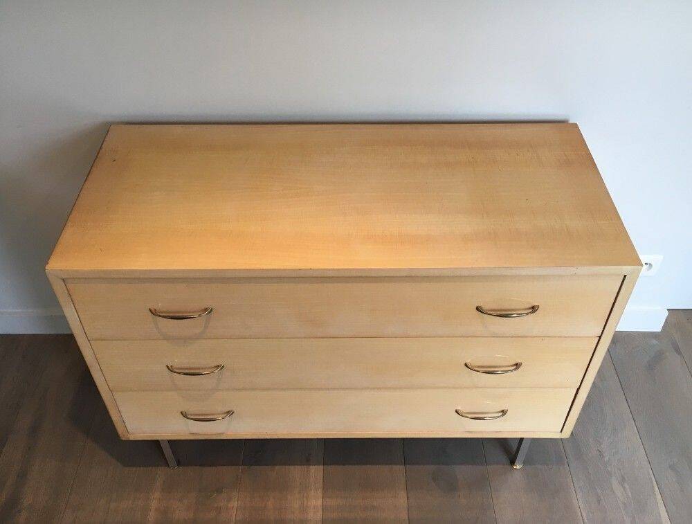 Eggshell lacquered chest of drawers with brushed steel legs. In the style of Knoll.