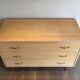 Eggshell lacquered chest of drawers with brushed steel legs. In the style of Knoll.