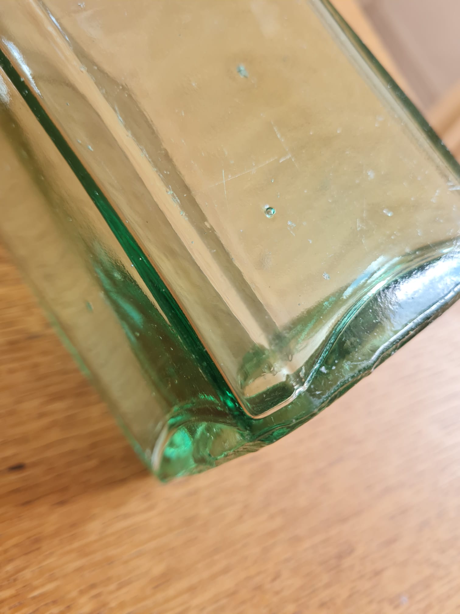 Green blown glass bottle