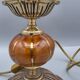 Hollywood Regency bedside lamp in gold metal with a glass globe.
