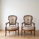 Pair of Voltaire armchairs in wood and floral fabric