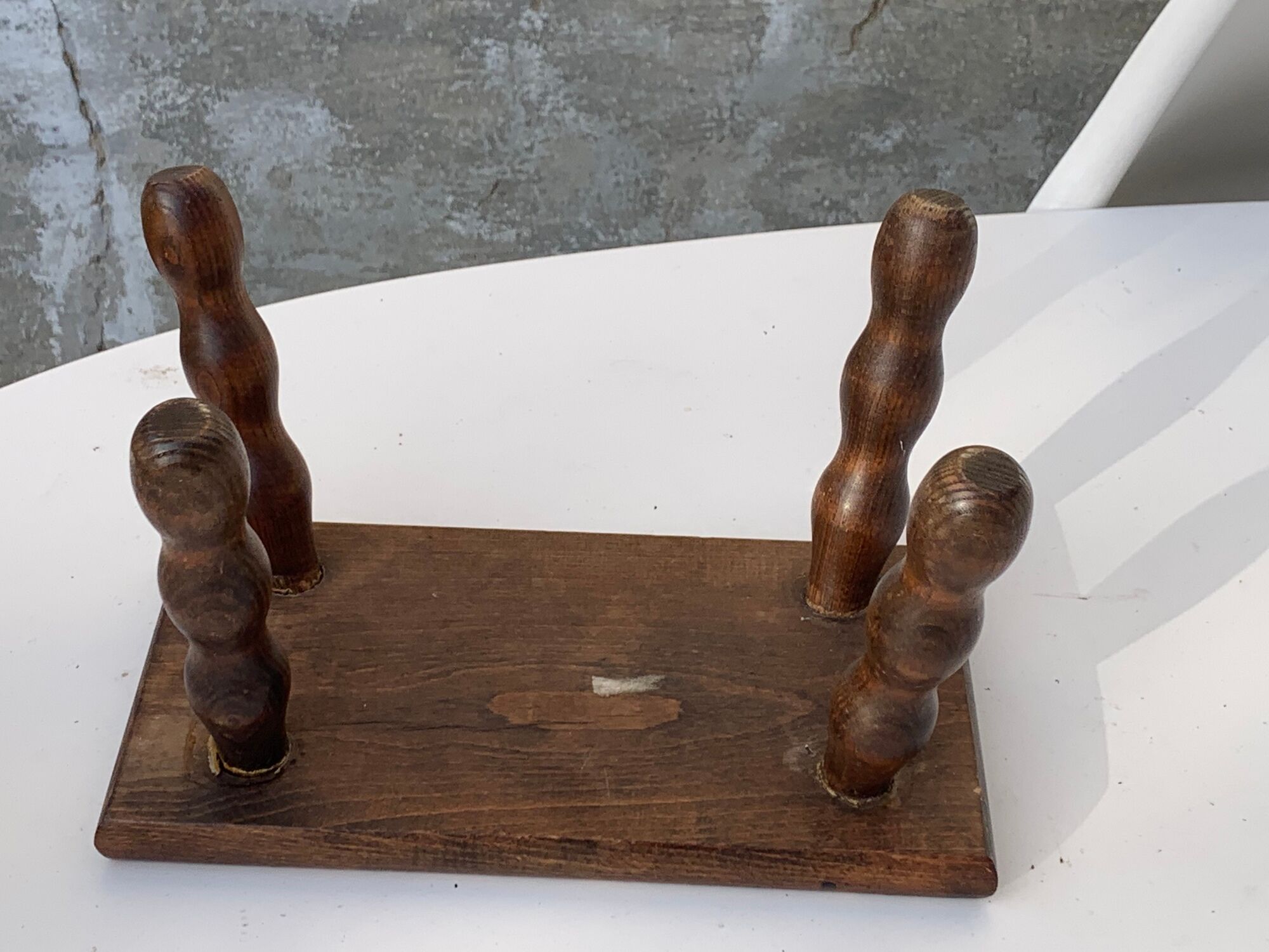 Footstool in varnished wood turns old